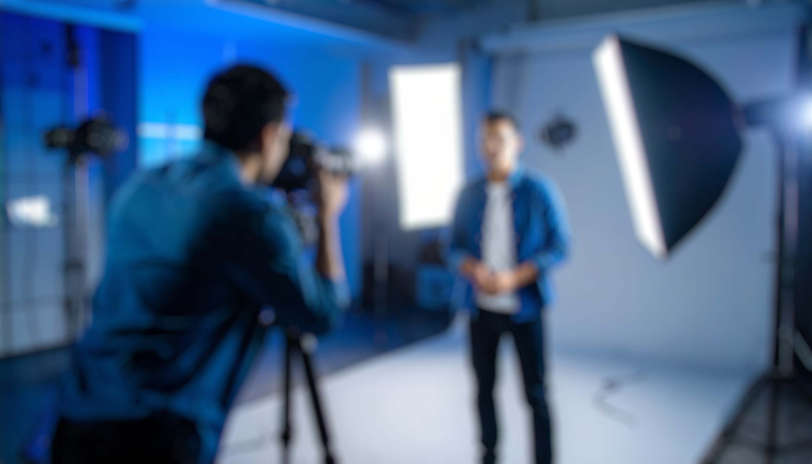 firefly a professional photographer in a modern studio setup taking a photo from another pers 376556